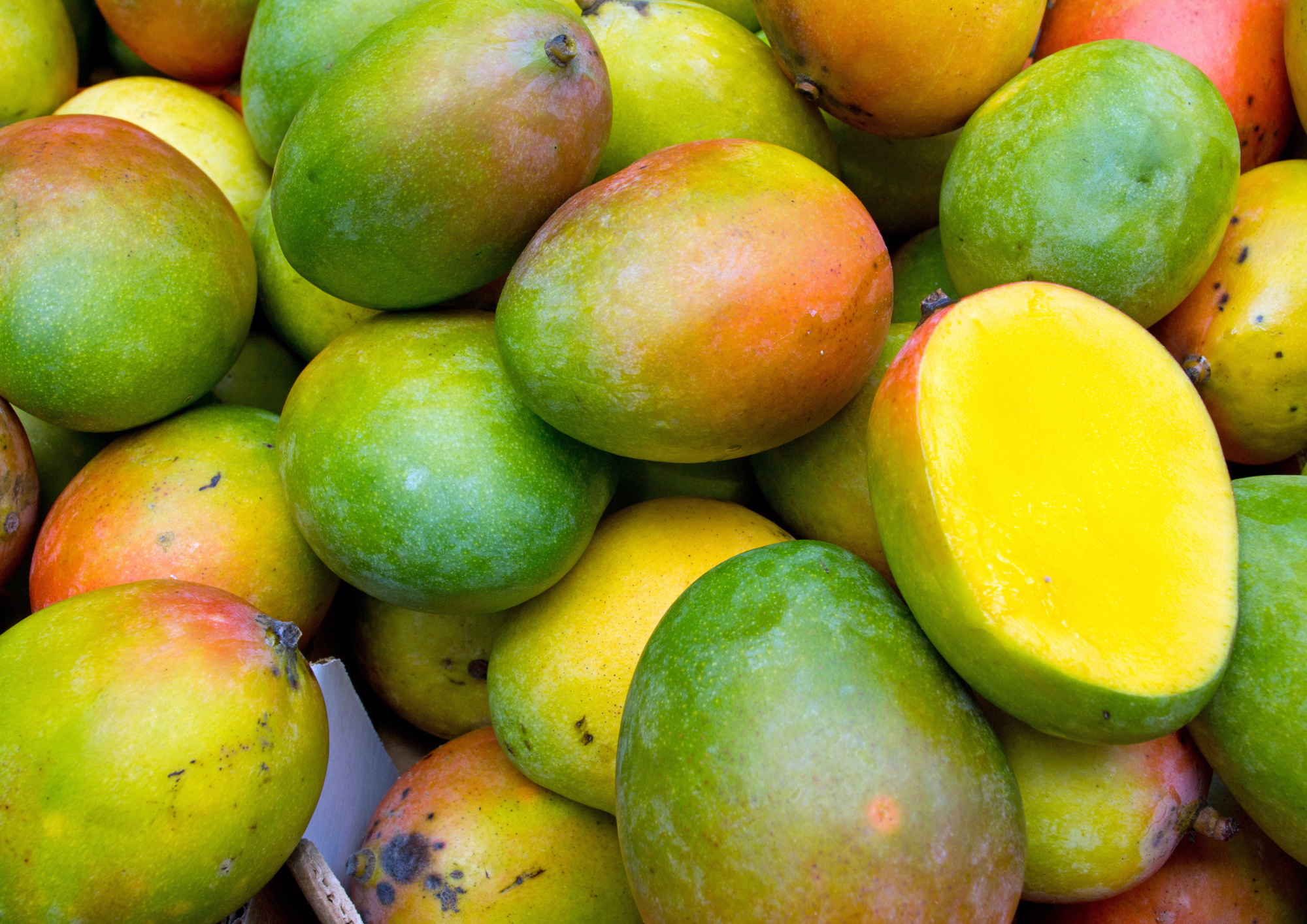Pile of yellow and green mangoes